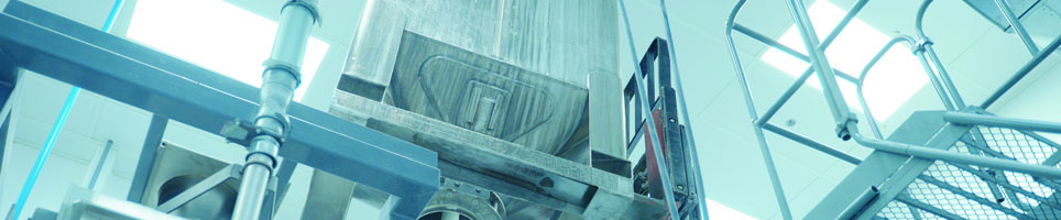 A lab filled with metal holding containers.